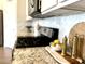 Kitchen close-up featuring granite countertops, marble backsplash, and sleek stainless steel appliances at 22443 E Munoz St, Queen Creek, AZ 85142