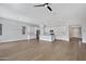 Bright and airy open-concept living space featuring stainless steel appliances, recessed lights, and wood floors at 22443 E Munoz St, Queen Creek, AZ 85142