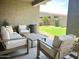 Inviting outdoor patio with comfortable seating, a view of the lush backyard, and serene ambiance at 22443 E Munoz St, Queen Creek, AZ 85142