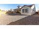 Backyard with low-maintenance landscape, a covered patio, and view of the home's elevation at 2260 E Warbler Rd, Gilbert, AZ 85297