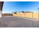 Wide open backyard space with a low-maintenance landscape and block wall perimeter at 2260 E Warbler Rd, Gilbert, AZ 85297