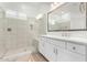 Well-lit bathroom featuring glass enclosed shower and white vanity with sink at 2260 E Warbler Rd, Gilbert, AZ 85297