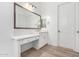 Bathroom vanity and makeup area with white cabinets, drawers, and stylish hardware at 2260 E Warbler Rd, Gilbert, AZ 85297