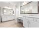 Spacious bathroom featuring dual sinks, white cabinetry, and glass-enclosed shower at 2260 E Warbler Rd, Gilbert, AZ 85297