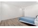 Open bedroom with wood-look floors and lots of natural light at 2260 E Warbler Rd, Gilbert, AZ 85297