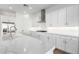 Modern kitchen featuring white cabinetry, stainless steel appliances, and quartz countertops at 2260 E Warbler Rd, Gilbert, AZ 85297