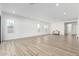 Spacious living room featuring tile floors, white walls, and great natural light at 2260 E Warbler Rd, Gilbert, AZ 85297