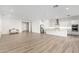 Spacious open concept living area with a sleek kitchen and lots of natural light at 2260 E Warbler Rd, Gilbert, AZ 85297
