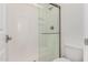 A well-lit walk-in shower featuring a glass door and shower head at 2260 E Warbler Rd, Gilbert, AZ 85297