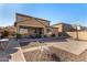 Spacious backyard with covered patio, basketball hoop and seating at 2324 W Melody Dr, Phoenix, AZ 85041