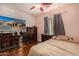 Bedroom with hardwood floors, a TV, and nice decor at 2324 W Melody Dr, Phoenix, AZ 85041