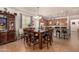 View of dining area with a table and chairs next to open kitchen and tile flooring at 2324 W Melody Dr, Phoenix, AZ 85041