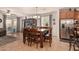 View of dining area and sliding glass doors with large table and chairs and TV at 2324 W Melody Dr, Phoenix, AZ 85041