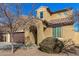 Charming two-story home featuring a tile roof, desert landscaping, and an arched entryway at 2324 W Melody Dr, Phoenix, AZ 85041