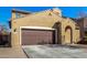 Exterior shot of a property with a two-car garage and low maintenance landscaping at 2324 W Melody Dr, Phoenix, AZ 85041