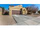 Well-maintained home featuring a spacious driveway leading to an attached two-car garage at 2324 W Melody Dr, Phoenix, AZ 85041