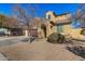 Charming two-story home featuring a tile roof, desert landscaping, and an arched entryway at 2324 W Melody Dr, Phoenix, AZ 85041
