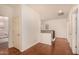 Bright hallway features wood floors and access to bedrooms at 2324 W Melody Dr, Phoenix, AZ 85041