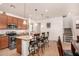 Open concept kitchen features granite countertops, stainless steel appliances, and island seating at 2324 W Melody Dr, Phoenix, AZ 85041