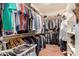 Well-organized walk-in closet with ample hanging space and built-in shelving at 2324 W Melody Dr, Phoenix, AZ 85041