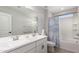 Bathroom with double vanity, ample counter space, and separate tub/shower combination at 24578 W Concorda Dr, Buckeye, AZ 85326