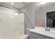 Bright bathroom featuring a glass-enclosed shower and a sleek vanity with modern fixtures at 24578 W Concorda Dr, Buckeye, AZ 85326