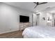 Bedroom showcases wood floors, a dresser, and closet access for convenient storage at 24578 W Concorda Dr, Buckeye, AZ 85326