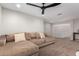 Bonus room featuring plush carpet, neutral walls, ceiling fan and comfortable sectional at 24578 W Concorda Dr, Buckeye, AZ 85326