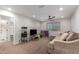 Spacious bonus room featuring plush carpet, neutral walls, ceiling fan and comfortable sectional at 24578 W Concorda Dr, Buckeye, AZ 85326