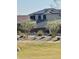 Two-story home features solar panels, desert landscaping, and neutral color palette at 24578 W Concorda Dr, Buckeye, AZ 85326