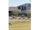 Two-story home features solar panels, desert landscaping, and neutral color palette at 24578 W Concorda Dr, Buckeye, AZ 85326
