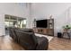 Spacious living room with tall ceilings and a sliding glass door leading to the patio at 24578 W Concorda Dr, Buckeye, AZ 85326