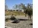 A serene park featuring desert landscaping, green spaces, and community amenities at 24578 W Concorda Dr, Buckeye, AZ 85326