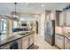 Stylish kitchen featuring granite countertops, stainless steel appliances, and island at 25925 W Mcrae Dr, Buckeye, AZ 85396