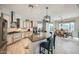 Spacious kitchen features a large island with bar seating and a view into the dining area at 25925 W Mcrae Dr, Buckeye, AZ 85396