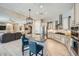 Open-concept kitchen with granite island, stainless steel appliances and seating at 25925 W Mcrae Dr, Buckeye, AZ 85396