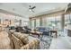 Spacious living room featuring plenty of seating and natural light with a kitchen view at 25925 W Mcrae Dr, Buckeye, AZ 85396