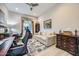 Home office space with a sofa and a view of the neighborhood at 25925 W Mcrae Dr, Buckeye, AZ 85396