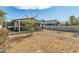 Backyard scene showcasing the patio area, swing set, and spacious layout, ideal for outdoor enjoyment at 2618 N 15Th St, Phoenix, AZ 85006