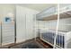 Bright bedroom with a lofted bed and crib at 2618 N 15Th St, Phoenix, AZ 85006