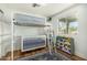Bright bedroom with a lofted bed, crib, and storage at 2618 N 15Th St, Phoenix, AZ 85006