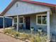 Inviting covered porch with seating and garden bed offers a relaxing outdoor space at 2618 N 15Th St, Phoenix, AZ 85006