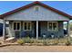 Charming front porch with garden bed and relaxing seating provides curb appeal at 2618 N 15Th St, Phoenix, AZ 85006