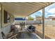 Covered patio featuring a seating area, outdoor dining, and spacious yard at 2618 N 15Th St, Phoenix, AZ 85006