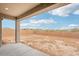 Spacious backyard featuring a covered patio, brick fence, and mountain views at 26361 N 76Th Dr, Peoria, AZ 85383