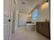 Bathroom with dual sinks, soaking tub, and step-in shower at 26361 N 76Th Dr, Peoria, AZ 85383