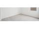 Bright bedroom with plush carpet and a window providing natural light at 26361 N 76Th Dr, Peoria, AZ 85383