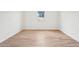 A bright and airy bedroom, featuring tile flooring and a large window at 26361 N 76Th Dr, Peoria, AZ 85383