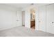 Bedroom with carpet, closet, and bathroom access at 26361 N 76Th Dr, Peoria, AZ 85383
