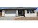 A charming single-story home showcasing a neutral color palette, two-car garage, and well-maintained landscaping at 26361 N 76Th Dr, Peoria, AZ 85383